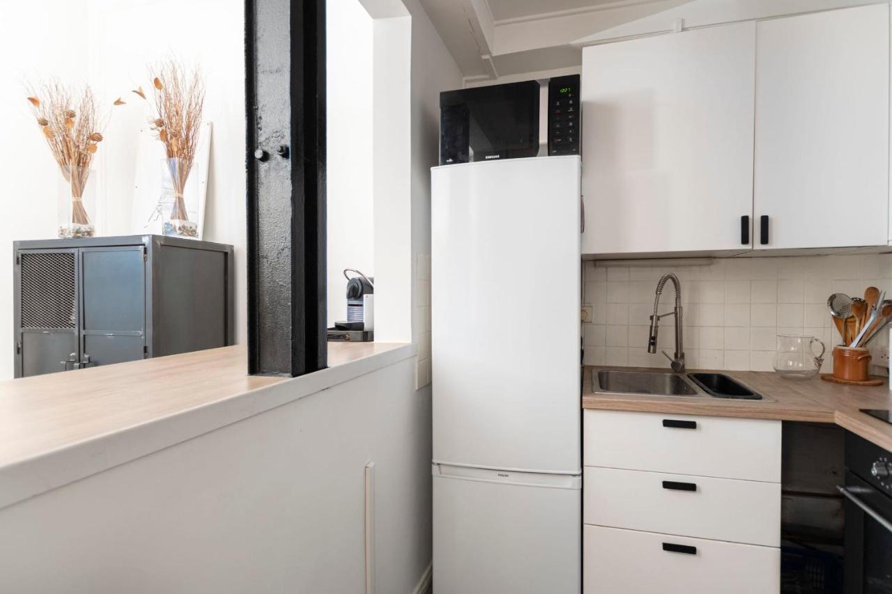 Appartamento Guestready - Lovely Bright Flat With Private Patio Parigi